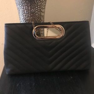 Black purse and gold chain strap